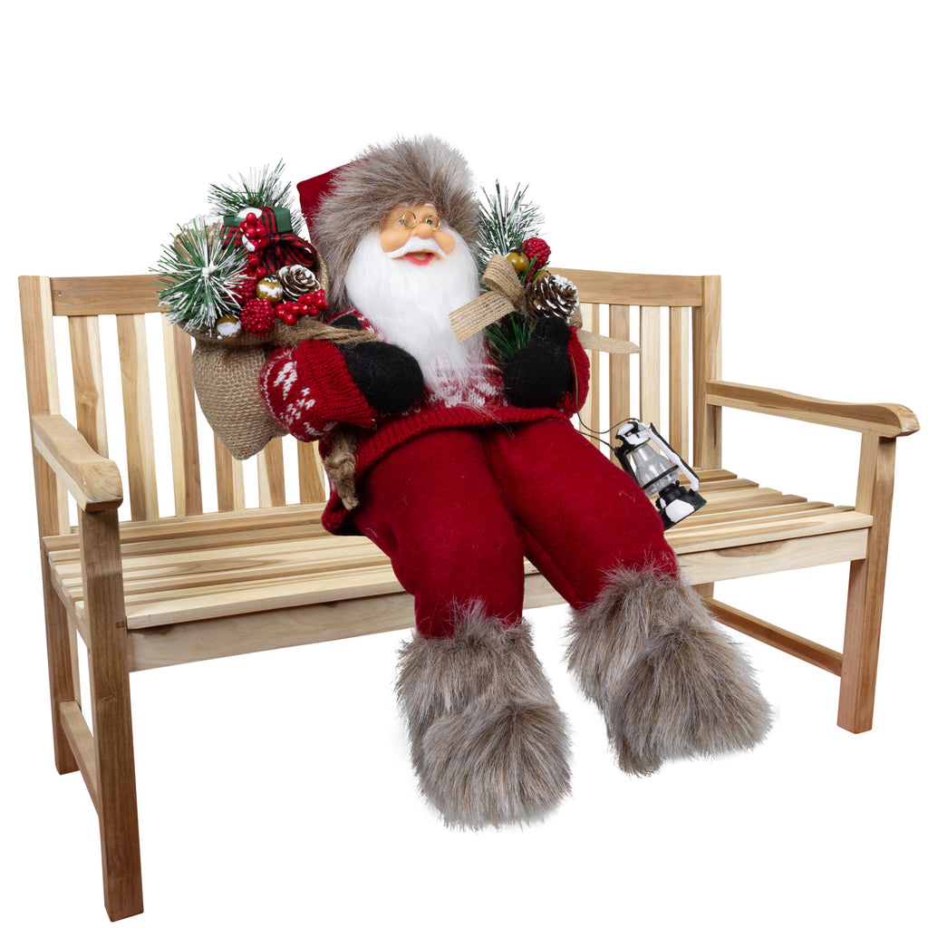 Weihnachtsmann 30 cm mit Laterne, Stiefel mit Fellbesatz, Jutesack und Winterzweigen Kantenhocker