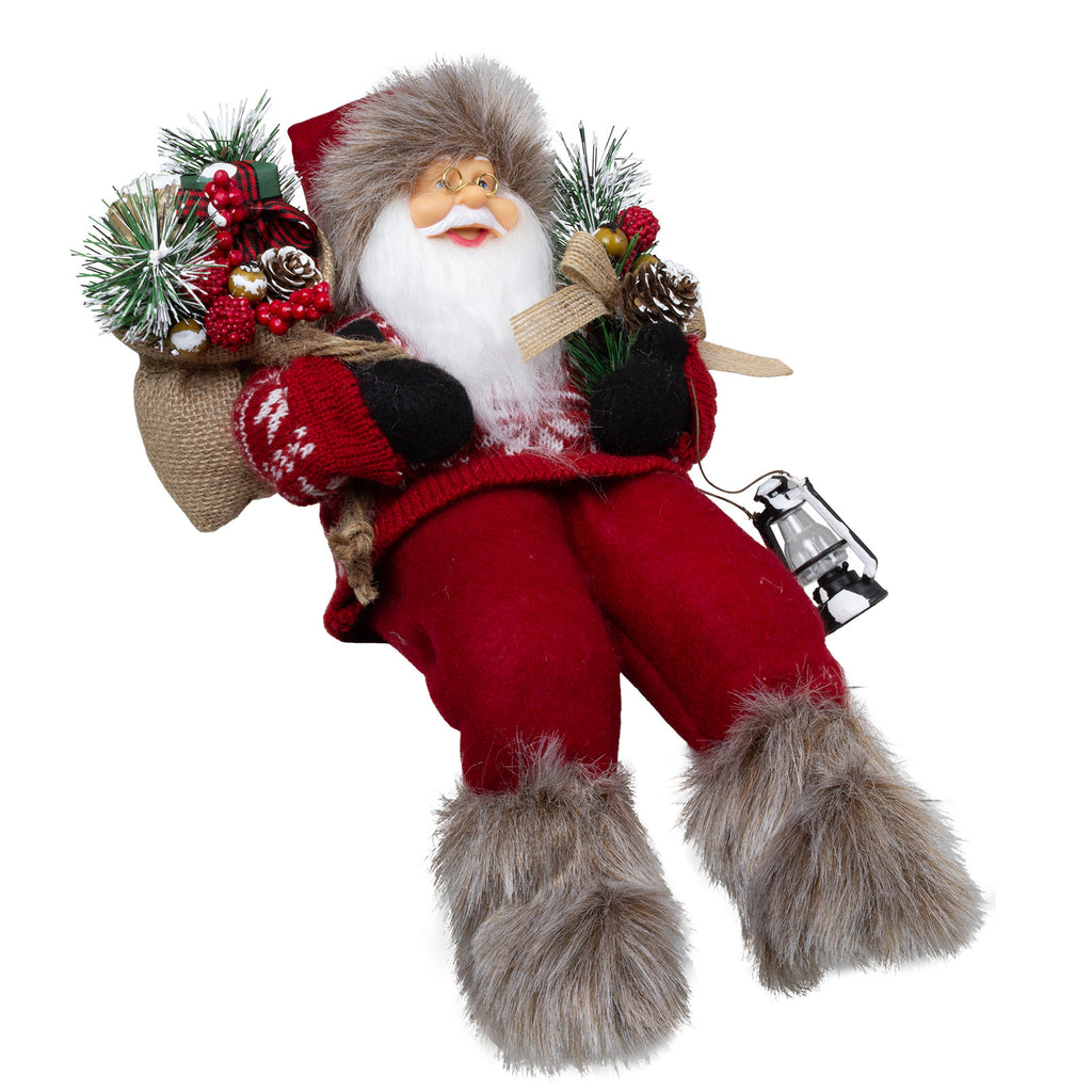 Weihnachtsmann 30 cm mit Laterne, Stiefel mit Fellbesatz, Jutesack und Winterzweigen Kantenhocker
